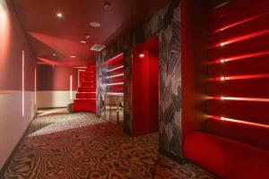 A bed or beds in a room at DuoMo Hotel