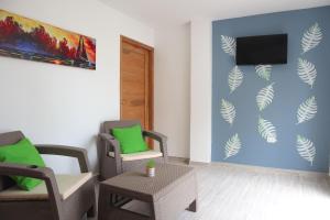TV a/nebo společenská místnost v ubytování Apartamento Villa Carolina 101