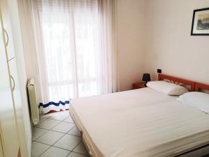 Postel nebo postele na pokoji v ubytování Fides Apartment