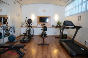 a gym with several exercise equipment in a room at Quality Hotel Galaxen in Borlänge