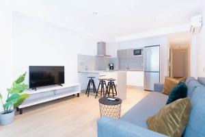 TV a/nebo společenská místnost v ubytování Sholeo Lodges La Cícer Flats