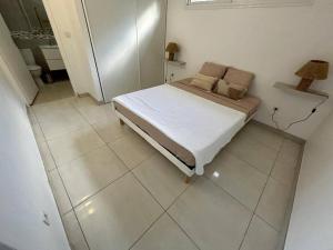 Ένα ή περισσότερα κρεβάτια σε δωμάτιο στο Villa Noo La