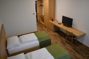 Posteľ alebo postele v izbe v ubytovaní Business Motel Feldkirch