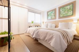 Posteľ alebo postele v izbe v ubytovaní Heart of San Sebastian⎮Walk Score 99⎮3 Baths