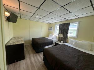 Postel nebo postele na pokoji v ubytování Searay - Motel