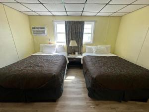 Postel nebo postele na pokoji v ubytování Searay - Motel