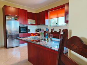 A kitchen or kitchenette at Pazinos/Neveli Cottage