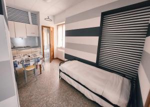 A bed or beds in a room at Residence Corallo
