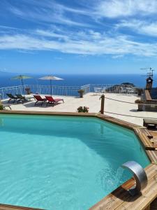 a swimming pool with a view of the ocean at Monte Brusara Relais in Ravello