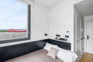 Postel nebo postele na pokoji v ubytování Home and CoLiving Pamplona