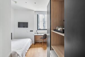 Postel nebo postele na pokoji v ubytování Home and CoLiving Pamplona