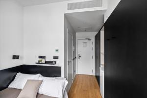 Postel nebo postele na pokoji v ubytování Home and CoLiving Pamplona