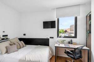 TV a/nebo společenská místnost v ubytování Home and CoLiving Pamplona