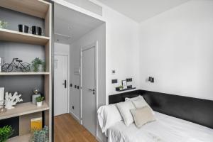 Postel nebo postele na pokoji v ubytování Home and CoLiving Pamplona