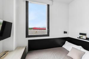 Postel nebo postele na pokoji v ubytování Home and CoLiving Pamplona