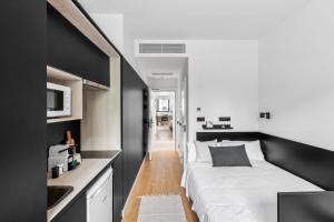 Postel nebo postele na pokoji v ubytování Home and CoLiving Pamplona