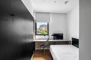 Postel nebo postele na pokoji v ubytování Home and CoLiving Pamplona