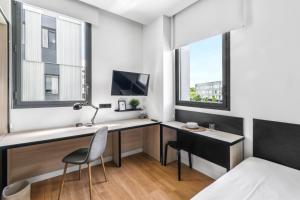 TV a/nebo společenská místnost v ubytování Home and CoLiving Pamplona