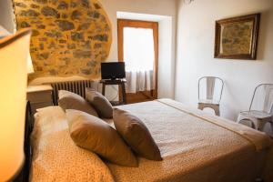 מיטה או מיטות בחדר ב-Country House Poggio Aione