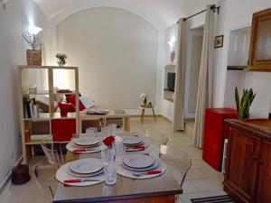 a living room with a table with plates on it at Il Borgo dei Mestieri in Spoleto