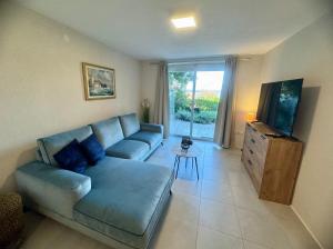 Televízia a/alebo spoločenská miestnosť v ubytovaní Apartment Urban Oasis