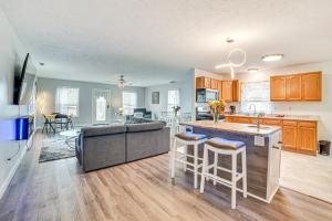 a kitchen and living room with a couch and a table at Cozy Illinois Retreat with Home Gym and River Views! in Chillicothe