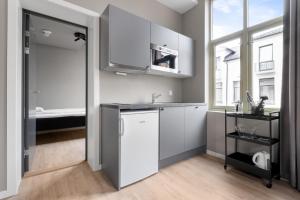 Kuchyň nebo kuchyňský kout v ubytování Forenom Serviced Apartments Drammen