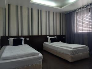 Postel nebo postele na pokoji v ubytování Hotel Rio