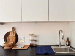 Kuchyňa alebo kuchynka v ubytovaní Fabuleux Appartement à Vincennes M1- Direct Disney