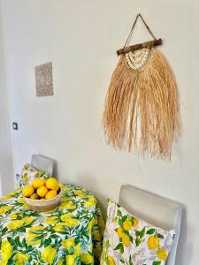 a room with a table with a bowl of oranges at Hotel Imperial in Dhërmi
