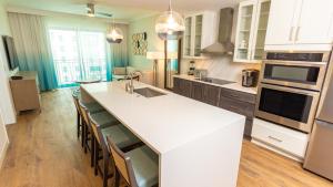 a kitchen with a large white island in a kitchen at Holiday Inn Club Vacations Myrtle Beach Oceanfront in Myrtle Beach
