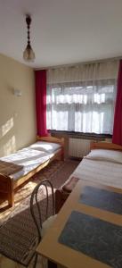 Cama o camas de una habitación en Noclegi Beskidzkie