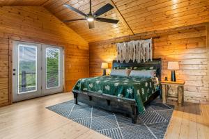a bedroom with a bed and a ceiling fan at Dawns View in Sevierville