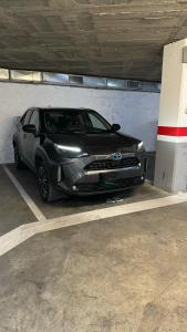a silver car parked in a parking garage at Moderno apartamento con Parking,Tarrassa, Barcelona in Terrassa