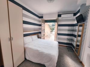 A bed or beds in a room at Residence Corallo