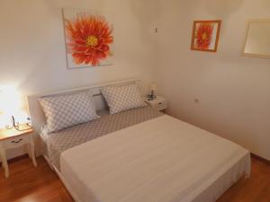 Llit o llits en una habitació de Apartments Tomi & Ivana