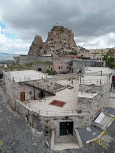 an amphitheater in front of a mountain at Memories Cave House in Uçhisar