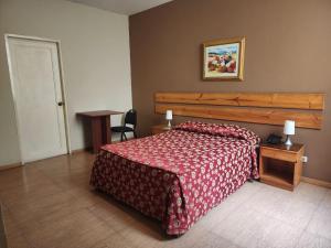 Postel nebo postele na pokoji v ubytování Hotel El Brujo Centro Histórico