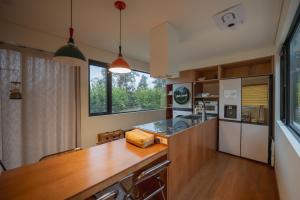 a kitchen with a wooden counter top in a room at Pet-friendly camping theme house anseongcamp96 by dazayo in Seogwipo