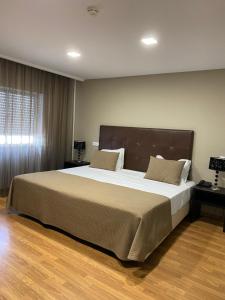 Postel nebo postele na pokoji v ubytování Hotel Paiva + 37 fotografií