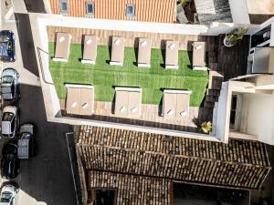 an overhead view of a building with a lawn at Neko Boutique Hotel in Cagliari