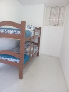 a room with two bunk beds and a window at POUSADA DAS NAÇÕES lll in Indaiatuba +16 photos