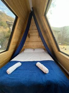 two pillows laying on a bed in a tent at Hill sunny2024 in Zemo Jocho +26 photos