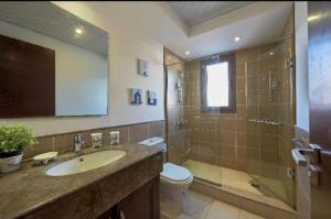 a bathroom with a sink and a shower and a toilet at Twin house in El Alamein +14 photos