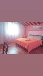 A bed or beds in a room at Il Podere di Massi