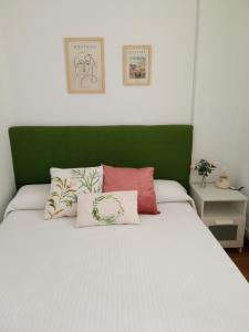 Un pat sau paturi într-o cameră la Amodiño,casa alquiler vacacional