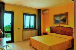 Postel nebo postele na pokoji v ubytování B&B Villa Sensi + 15 fotografií