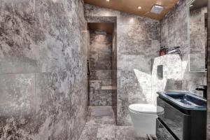 a bathroom with a toilet and a sink at Skyline Studios in London +40 photos