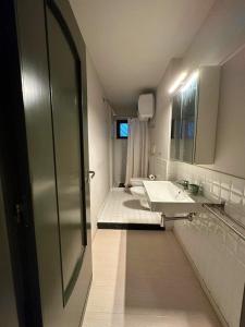 a bathroom with a sink and a mirror at Casetta in Andria