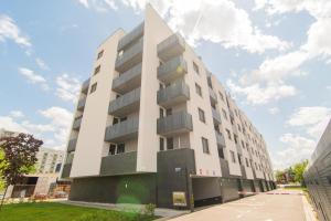 a tall white building with a lot of windows at Flexible SelfCheckIns 81 - Zagreb - Arena - Garage - Loggia in Zagreb